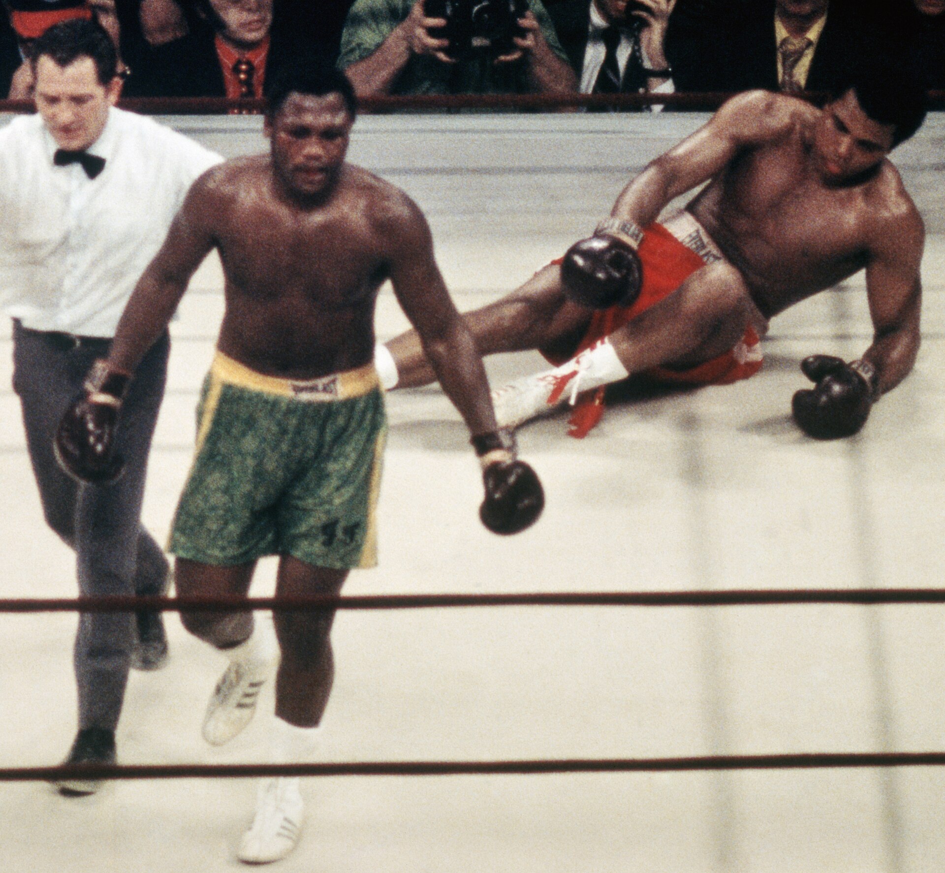 Joe Frazier standing over Muhammad Ali after a knockdown in the 15th round