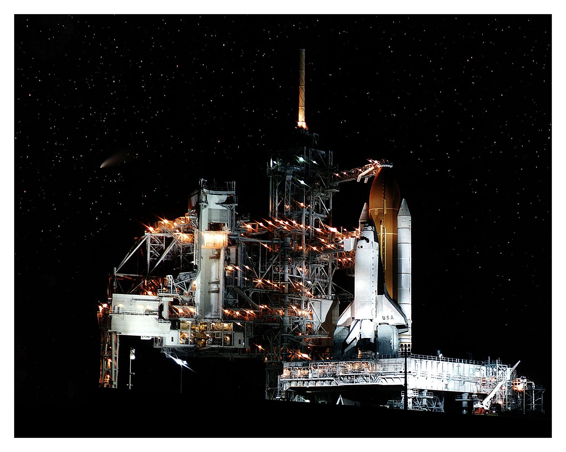 Space Shuttle Columbia on pad with Comet Hale-Bopp